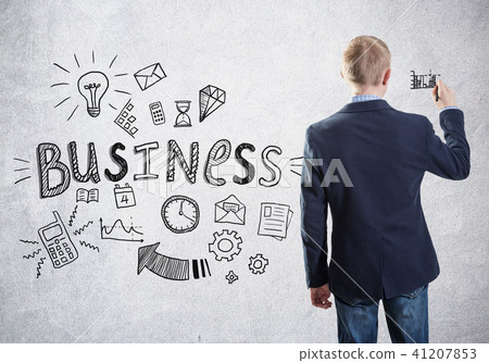 Back view of a businessman drawing a sketch on a wall 41207853