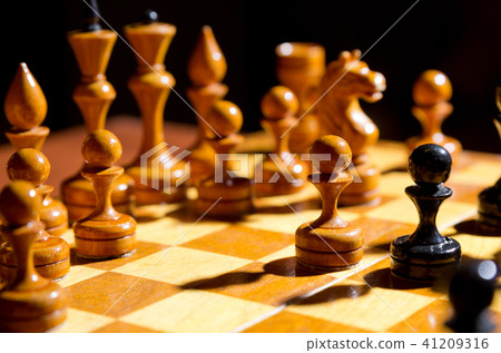 Chessboard with figures on dark 41209316