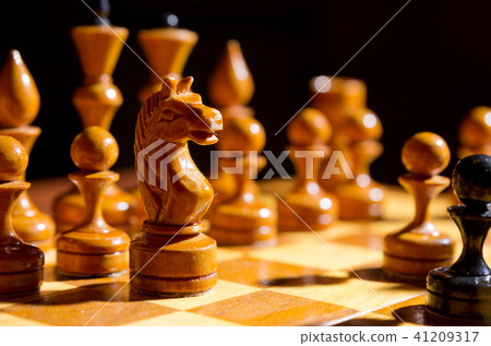 Chessboard with figures on dark 41209317
