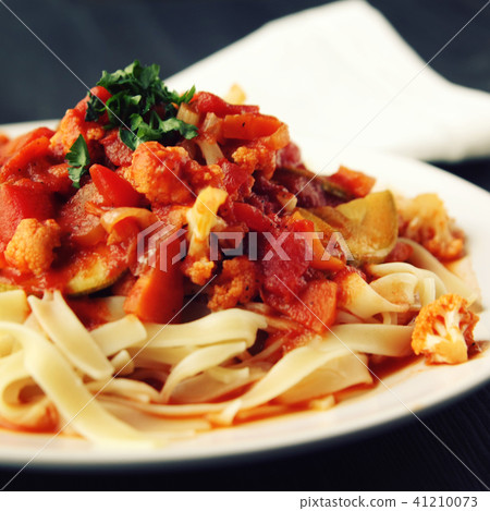 Ribbon pasta with Arrabiata sauce. Close up. Vegan 41210073