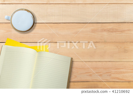 Empty book and hot coffee on wooden desk, copy space, mock up 41210692