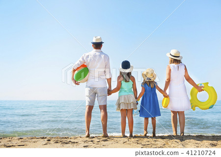 Portrait of a family with two children at beach.  41210724