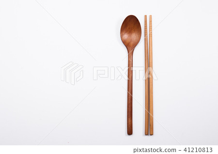 Wooden spoon and chopsticks on white background Wooden spoon and chopsticks on white background 41210813