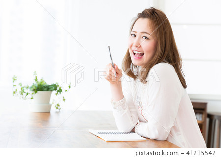 A woman taking a note A woman taking a note 41215542