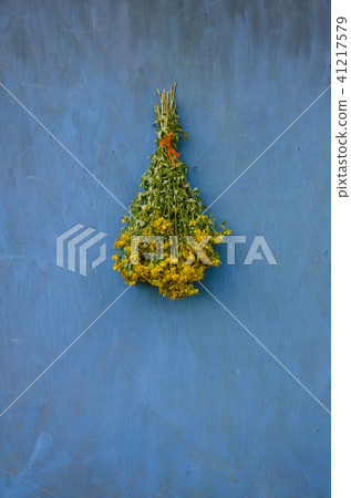 Bouquet bunch St John's wort hang on wooden wall Bouquet bunch St John's wort hang on wooden wall 41217579