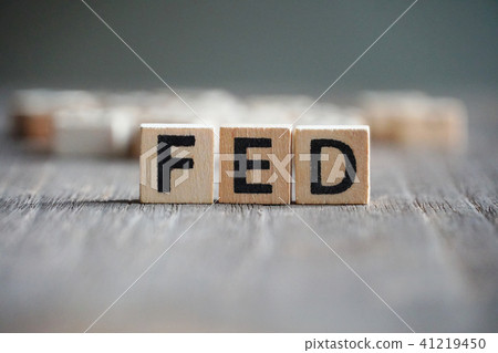 Word "FED" on cube dice on wood table Word "FED" on cube dice on wood table 41219450