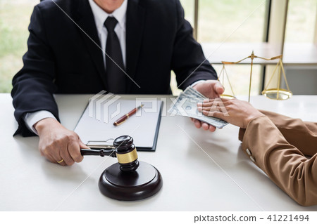 Bribery and corruption concept, bribe in the form of dollar bill Bribery and corruption concept, bribe in the form of dollar bill 41221494
