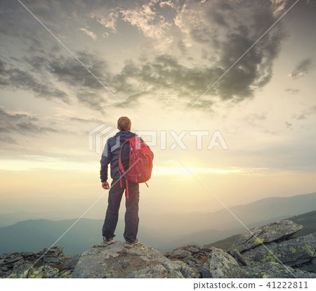 Tourist on the peak of high rocks Tourist on the peak of high rocks 41222811
