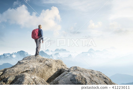 Tourist on the peak of high rocks Tourist on the peak of high rocks 41223011