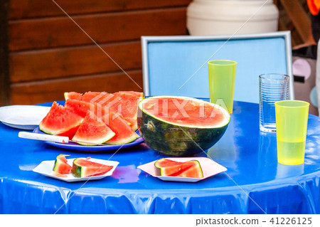 Watermelon prepared on blue table Watermelon prepared on blue table 41226125
