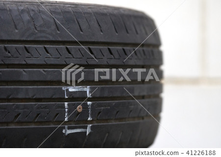 Tires on the floor are damaged by hitting nails Tires on the floor are damaged by hitting nails 41226188