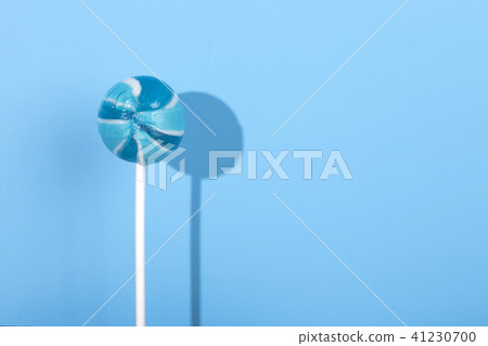 Bue Lolipop candy with shadow on pastel blue background Bue Lolipop candy with shadow on pastel blue background 41230700