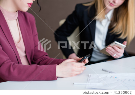 bored business women office idler looking phone bored business women office idler looking phone 41230902
