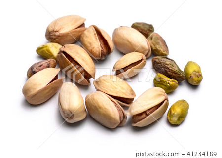 Pile of roasted pistachio nuts isolated on white Pile of roasted pistachio nuts isolated on white 41234189
