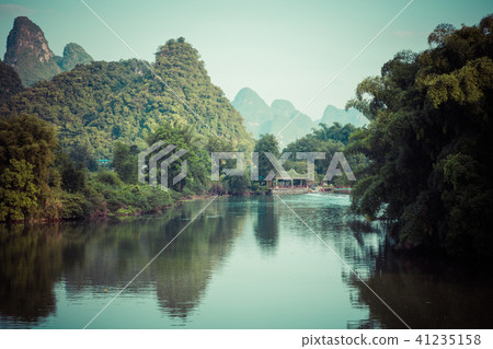 Scenic view of Yulong River among green woods 41235158