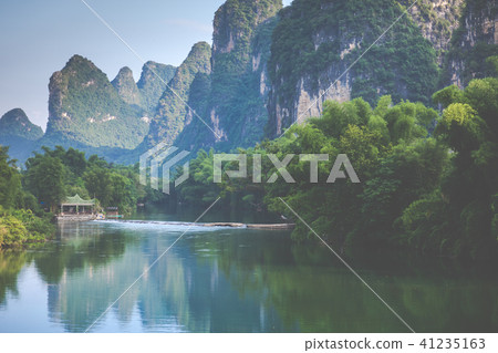 Scenic view of Yulong River among green woods 41235163