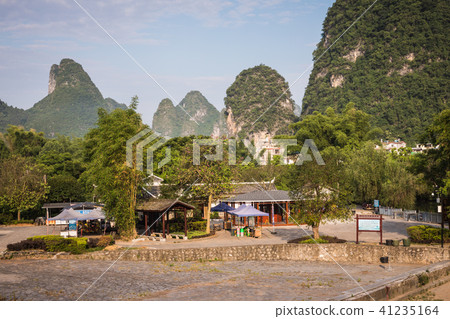 Scenic view of Yulong River among green woods 41235164