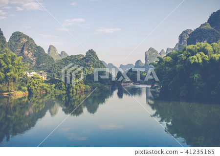 Scenic view of Yulong River among green woods 41235165