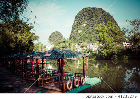 Scenic view of small tourist bamboo rafts sailing 41235279