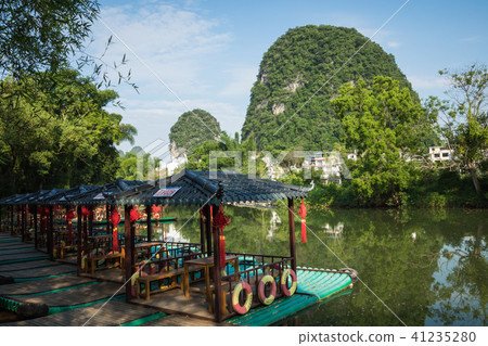 Scenic view of small tourist bamboo rafts sailing 41235280