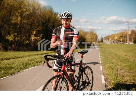 Cyclist in sportswear, training on track bike 41235393