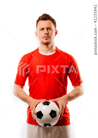 Young soccer player with ball on black background in studio. 41235941