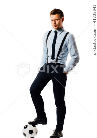 young handsome businessman holding a football isolated on white background studio. young handsome businessman holding a football isolated on white background studio. 41235943