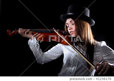 Pretty young woman playing a violin 41236170