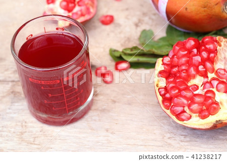 pomegranate fruit with juice pomegranate fruit with juice 41238217