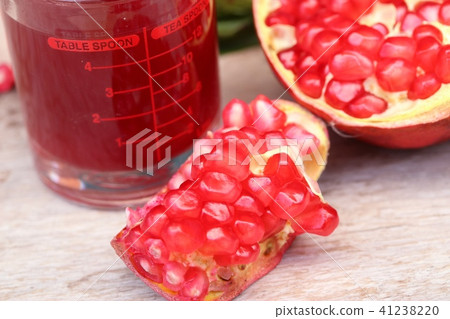 pomegranate fruit with juice pomegranate fruit with juice 41238220