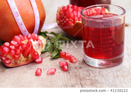 pomegranate fruit with juice pomegranate fruit with juice 41238222