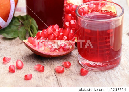 pomegranate fruit with juice pomegranate fruit with juice 41238224