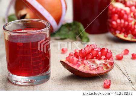 pomegranate fruit with juice pomegranate fruit with juice 41238232