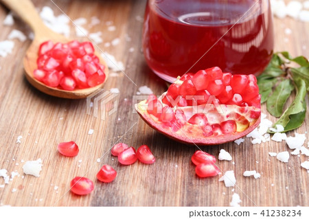 pomegranate fruit with juice pomegranate fruit with juice 41238234