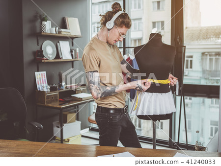 Glad man having job with mannequin Glad man having job with mannequin 41240033
