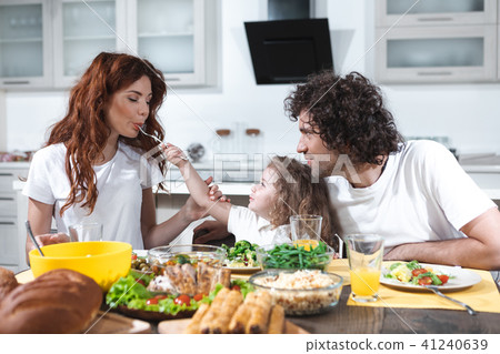 Joyful family having lunch together at home Joyful family having lunch together at home 41240639