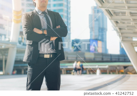 businessman stands in city. businessman stands in city. 41242752