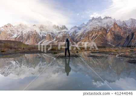:a man standing at Passu Cathedral valley :a man standing at Passu Cathedral valley 41244046