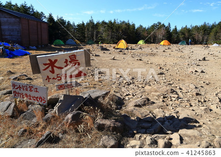 A tent area of a youth hut at the foot of Yatsugatake mountainous mountains A tent area of a youth hut at the foot of Yatsugatake mountainous mountains 41245863