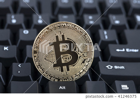 Bit coin on keyboard 41246375