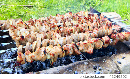 Appetizing shashlik outside.Process of cooking mea Appetizing shashlik outside.Process of cooking mea 41249202