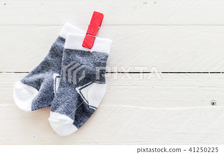 Baby socks on a wooden background  with copy space 41250225