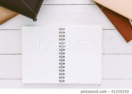 Open blank notepad with empty white pages  41250250
