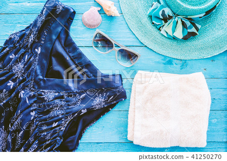 Beach accessories on wooden table Beach accessories on wooden table 41250270