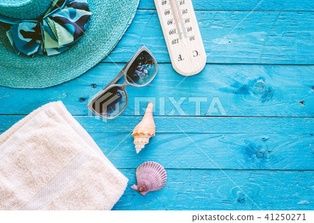Beach accessories on wooden table Beach accessories on wooden table 41250271