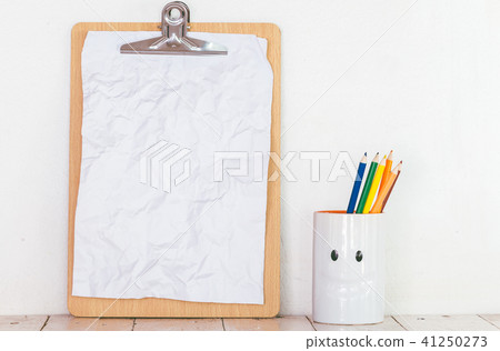 Paper in clipboard  on wooden table 41250273