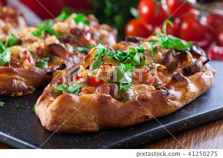 Traditional Turkish pide with meat and vegetables 41250275
