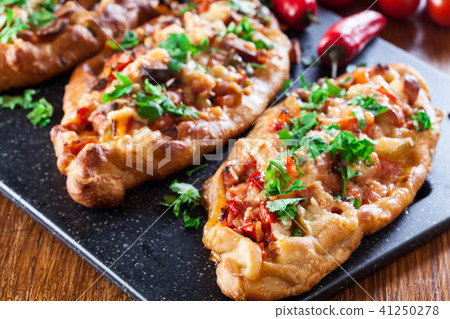 Traditional Turkish pide with meat and vegetables Traditional Turkish pide with meat and vegetables 41250278