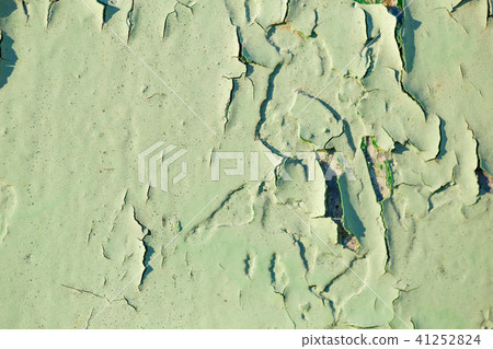 Irradiated green paint on rusty iron closeup Irradiated green paint on rusty iron closeup 41252824