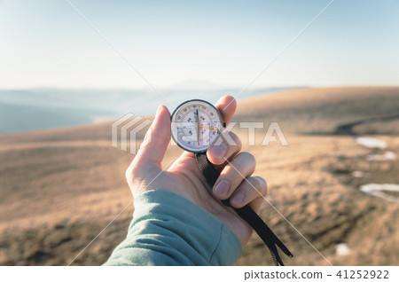 Compass in Hand Natural background .Vintage Tone 41252922